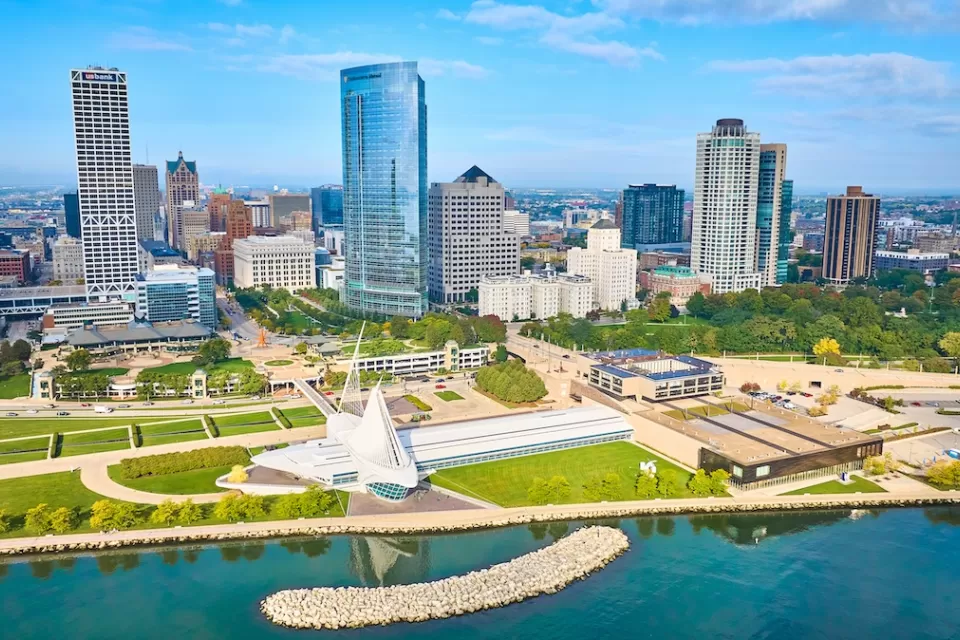 Aerial view of downtown Milwaukee, Wisconsin with Quadracci Pavilion on waterfront in foreground.